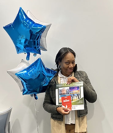 credit union day winner displays prize