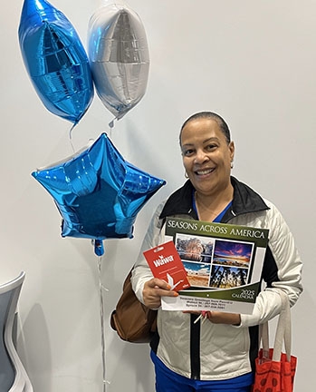 credit union day winner displays prize
