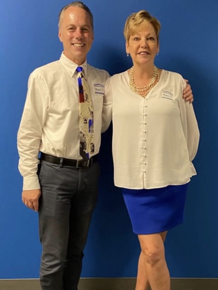 Maryanne Klein poses for a retirement picture with new CEO Ken Stone